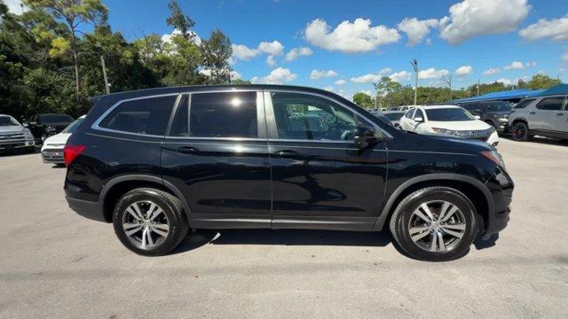2017 Black Honda Pilot (5FNYF5H80HB) with an 6 3.5 L engine, Automatic transmission, located at 27610 S Dixie Hwy, Homestead, FL, 33032, (305) 749-2348, 25.510241, -80.438301 - IIHS Top Safety Pick+. Delivers 27 Highway MPG and 19 City MPG! This Honda Pilot boasts a Regular Unleaded V-6 3.5 L/212 engine powering this Automatic transmission. Window Grid Antenna, Wheels: 18 Alloy, Wheels w/Machined Accents.*This Honda Pilot Comes Equipped with These Options *VSA Electronic S - Photo#5