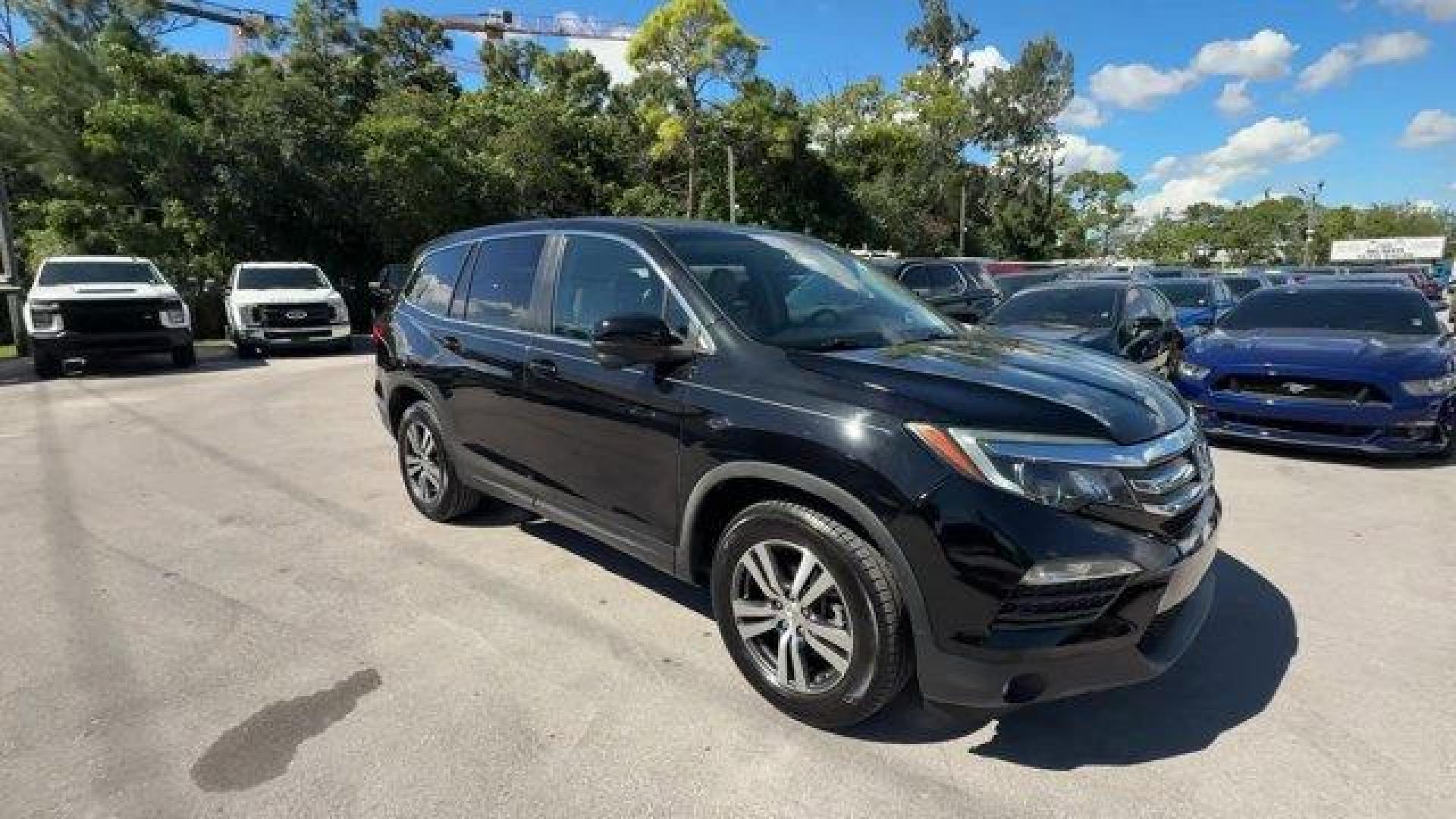 2017 Black Honda Pilot (5FNYF5H80HB) with an 6 3.5 L engine, Automatic transmission, located at 27610 S Dixie Hwy, Homestead, FL, 33032, (305) 749-2348, 25.510241, -80.438301 - IIHS Top Safety Pick+. Delivers 27 Highway MPG and 19 City MPG! This Honda Pilot boasts a Regular Unleaded V-6 3.5 L/212 engine powering this Automatic transmission. Window Grid Antenna, Wheels: 18 Alloy, Wheels w/Machined Accents.*This Honda Pilot Comes Equipped with These Options *VSA Electronic S - Photo#6