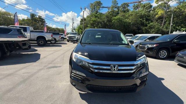 2017 Black Honda Pilot (5FNYF5H80HB) with an 6 3.5 L engine, Automatic transmission, located at 27610 S Dixie Hwy, Homestead, FL, 33032, (305) 749-2348, 25.510241, -80.438301 - IIHS Top Safety Pick+. Delivers 27 Highway MPG and 19 City MPG! This Honda Pilot boasts a Regular Unleaded V-6 3.5 L/212 engine powering this Automatic transmission. Window Grid Antenna, Wheels: 18 Alloy, Wheels w/Machined Accents.*This Honda Pilot Comes Equipped with These Options *VSA Electronic S - Photo#7