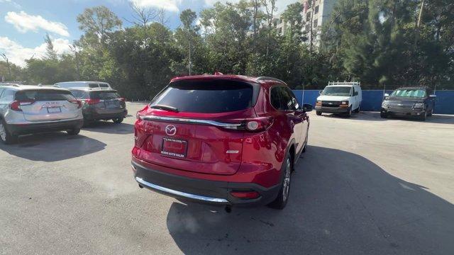 2019 Soul Red Crystal Metallic /Black Mazda CX-9 (JM3TCADY8K0) with an 4 2.5 L engine, Automatic transmission, located at 27610 S Dixie Hwy, Homestead, FL, 33032, (305) 749-2348, 25.510241, -80.438301 - KBB.com Brand Image Awards. Only 62,225 Miles! Boasts 28 Highway MPG and 22 City MPG! This Mazda CX-9 boasts a Intercooled Turbo Regular Unleaded I-4 2.5 L/152 engine powering this Automatic transmission. Wireless Phone Connectivity, Wheels w/Silver Accents, Trunk/Hatch Auto-Latch.*This Mazda CX-9 C - Photo#4