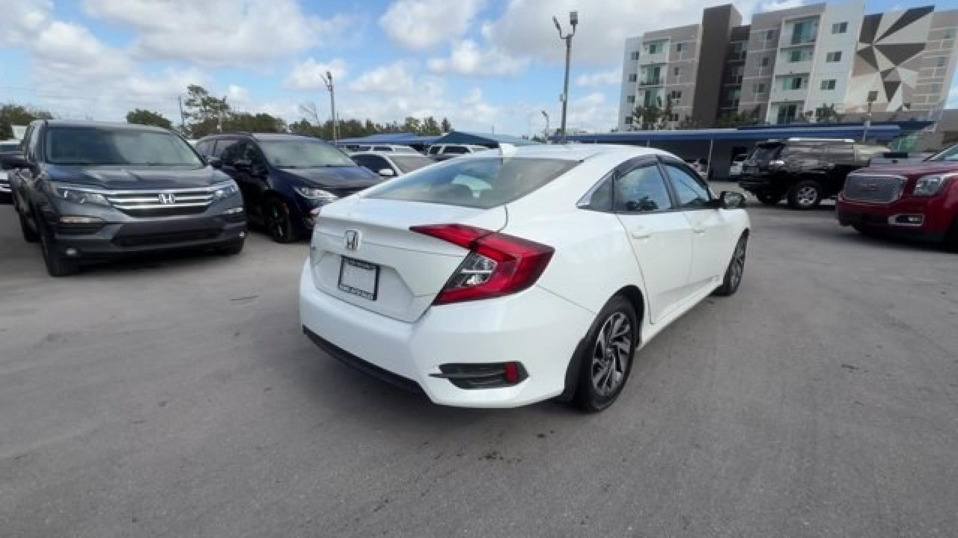 2017 White Honda Civic Sedan (2HGFC2F78HH) with an 4 2.0 L engine, Variable transmission, located at 27610 S Dixie Hwy, Homestead, FL, 33032, (305) 749-2348, 25.510241, -80.438301 - IIHS Top Safety Pick. Delivers 40 Highway MPG and 31 City MPG! This Honda Civic Sedan delivers a Regular Unleaded I-4 2.0 L/122 engine powering this Variable transmission. Wireless Phone Connectivity, Window Grid Antenna, Wheels: 16 Alloy.* This Honda Civic Sedan Features the Following Options *Whee - Photo#4
