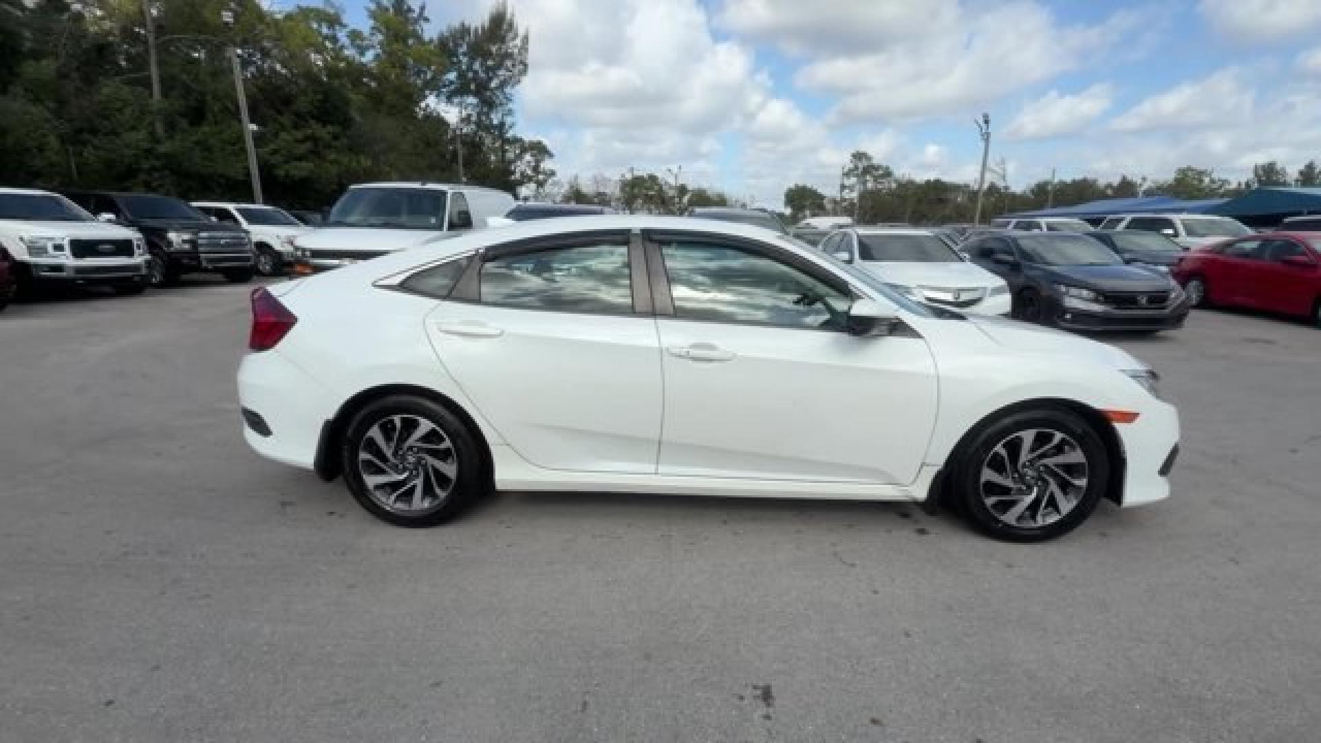 2017 White Honda Civic Sedan (2HGFC2F78HH) with an 4 2.0 L engine, Variable transmission, located at 27610 S Dixie Hwy, Homestead, FL, 33032, (305) 749-2348, 25.510241, -80.438301 - IIHS Top Safety Pick. Delivers 40 Highway MPG and 31 City MPG! This Honda Civic Sedan delivers a Regular Unleaded I-4 2.0 L/122 engine powering this Variable transmission. Wireless Phone Connectivity, Window Grid Antenna, Wheels: 16 Alloy.* This Honda Civic Sedan Features the Following Options *Whee - Photo#5