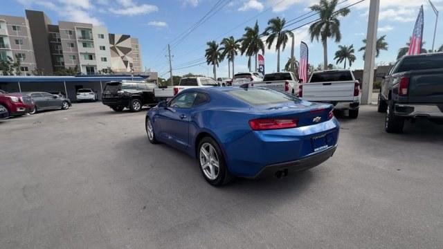 2016 Hyper Blue Metallic /Jet Black Chevrolet Camaro (1G1FA1RX8G0) with an 4 2.0L engine, Manual transmission, located at 27610 S Dixie Hwy, Homestead, FL, 33032, (305) 749-2348, 25.510241, -80.438301 - Ward's 10 Best Engines. Only 95,841 Miles! Boasts 30 Highway MPG and 21 City MPG! This Chevrolet Camaro delivers a Gas I4 2.0L/122 engine powering this Manual transmission. WHEELS, 18 (45.7 CM) SILVER-PAINTED ALUMINUM (STD), TRANSMISSION, 6-SPEED MANUAL (STD), TIRES, 245/50R18, BLACKWALL, ALL-SEASON - Photo#2
