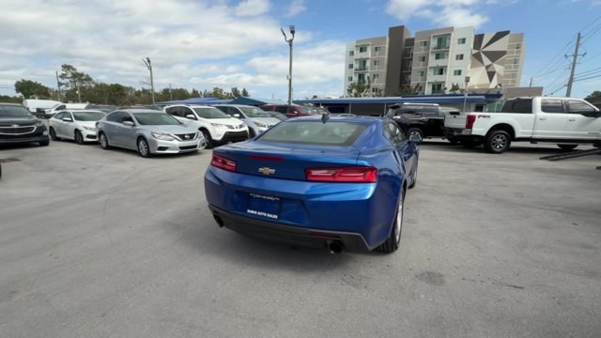 2016 Hyper Blue Metallic /Jet Black Chevrolet Camaro (1G1FA1RX8G0) with an 4 2.0L engine, Manual transmission, located at 27610 S Dixie Hwy, Homestead, FL, 33032, (305) 749-2348, 25.510241, -80.438301 - Ward's 10 Best Engines. Only 95,841 Miles! Boasts 30 Highway MPG and 21 City MPG! This Chevrolet Camaro delivers a Gas I4 2.0L/122 engine powering this Manual transmission. WHEELS, 18 (45.7 CM) SILVER-PAINTED ALUMINUM (STD), TRANSMISSION, 6-SPEED MANUAL (STD), TIRES, 245/50R18, BLACKWALL, ALL-SEASON- Photo#4