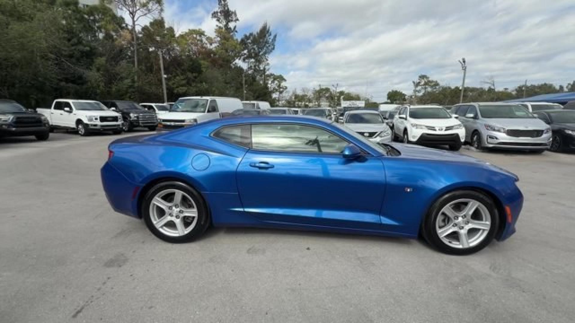 2016 Hyper Blue Metallic /Jet Black Chevrolet Camaro (1G1FA1RX8G0) with an 4 2.0L engine, Manual transmission, located at 27610 S Dixie Hwy, Homestead, FL, 33032, (305) 749-2348, 25.510241, -80.438301 - Ward's 10 Best Engines. Only 95,841 Miles! Boasts 30 Highway MPG and 21 City MPG! This Chevrolet Camaro delivers a Gas I4 2.0L/122 engine powering this Manual transmission. WHEELS, 18 (45.7 CM) SILVER-PAINTED ALUMINUM (STD), TRANSMISSION, 6-SPEED MANUAL (STD), TIRES, 245/50R18, BLACKWALL, ALL-SEASON- Photo#5