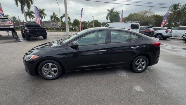 2017 Phantom Black /Beige Hyundai Elantra (5NPD94LA5HH) with an 4 1.4 L engine, Automatic transmission, located at 27610 S Dixie Hwy, Homestead, FL, 33032, (305) 749-2348, 25.510241, -80.438301 - IIHS Top Safety Pick+, Top Safety Pick+. Boasts 40 Highway MPG and 32 City MPG! This Hyundai Elantra delivers a Intercooled Turbo Regular Unleaded I-4 1.4 L/83 engine powering this Automatic transmission. REVERSIBLE CARGO TRAY, REAR BUMPER APPLIQUE, PHANTOM BLACK.*This Hyundai Elantra Comes Equipped - Photo#1