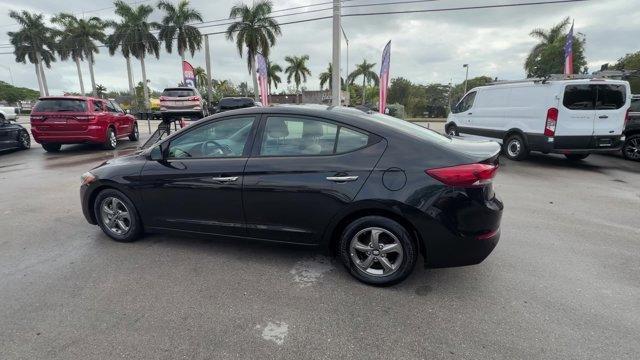 2017 Phantom Black /Beige Hyundai Elantra (5NPD94LA5HH) with an 4 1.4 L engine, Automatic transmission, located at 27610 S Dixie Hwy, Homestead, FL, 33032, (305) 749-2348, 25.510241, -80.438301 - IIHS Top Safety Pick+, Top Safety Pick+. Boasts 40 Highway MPG and 32 City MPG! This Hyundai Elantra delivers a Intercooled Turbo Regular Unleaded I-4 1.4 L/83 engine powering this Automatic transmission. REVERSIBLE CARGO TRAY, REAR BUMPER APPLIQUE, PHANTOM BLACK.*This Hyundai Elantra Comes Equipped - Photo#2