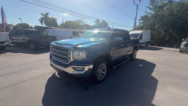2018 Stone Blue Metallic /Dark Ash seats with Jet Black interior accents GMC Sierra 1500 (3GTU2NEC1JG) with an 8 5.3L engine, Automatic transmission, located at 27610 S Dixie Hwy, Homestead, FL, 33032, (305) 749-2348, 25.510241, -80.438301 - Delivers 20 Highway MPG and 15 City MPG! This GMC Sierra 1500 delivers a Gas V8 5.3L/325 engine powering this Automatic transmission. WIRELESS CHARGING, WINDOW, POWER, REAR SLIDING WITH REAR DEFOGGER, WHEELS, 20 X 9 (50.8 CM X 22.9 CM) POLISHED ALUMINUM.* This GMC Sierra 1500 Features the Following - Photo#0