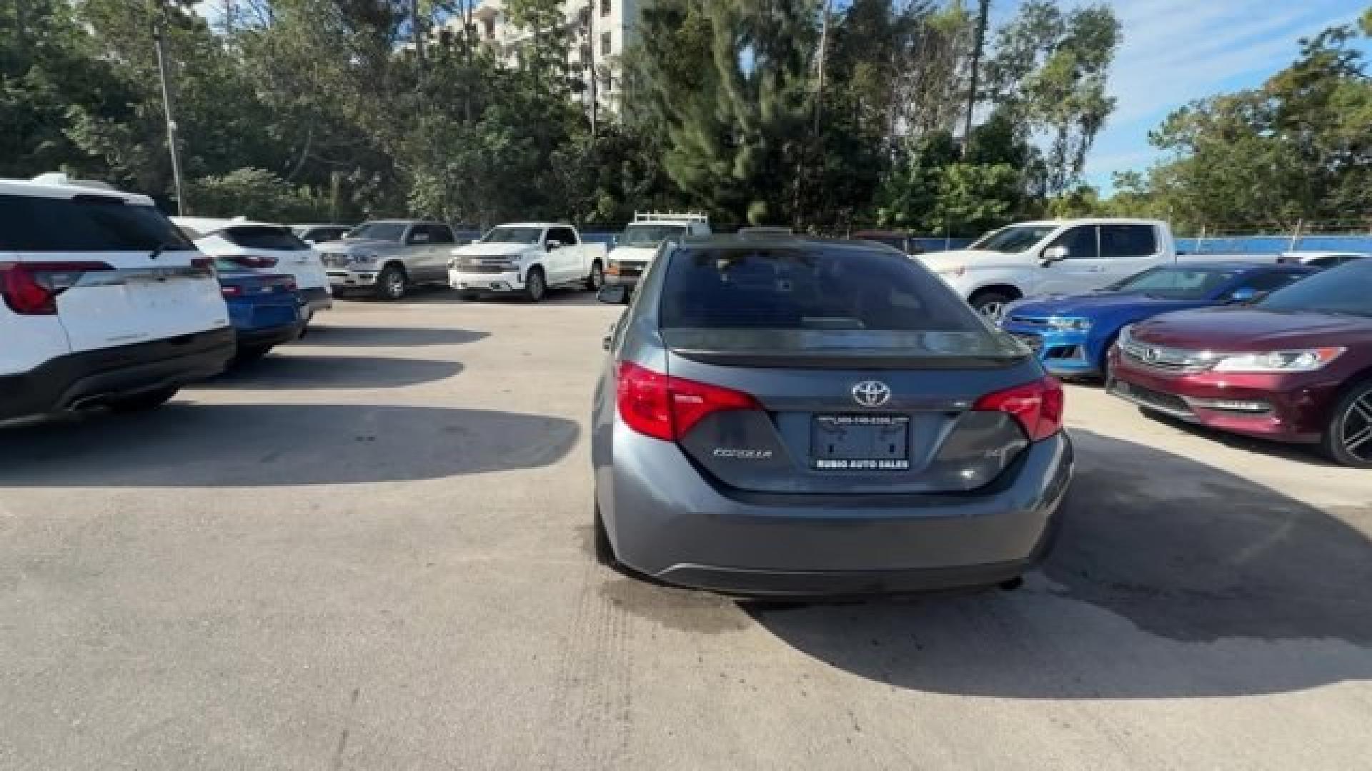 2018 Gray Toyota Corolla (5YFBURHEXJP) with an 4 1.8 L engine, Variable transmission, located at 27610 S Dixie Hwy, Homestead, FL, 33032, (305) 749-2348, 25.510241, -80.438301 - KBB.com 10 Most Awarded Brands. This Toyota Corolla boasts a Regular Unleaded I-4 1.8 L/110 engine powering this Variable transmission. Wireless Phone Connectivity, Urethane Gear Shifter Material, Trunk Rear Cargo Access.*This Toyota Corolla Comes Equipped with These Options *Trip Computer, Transmis - Photo#2