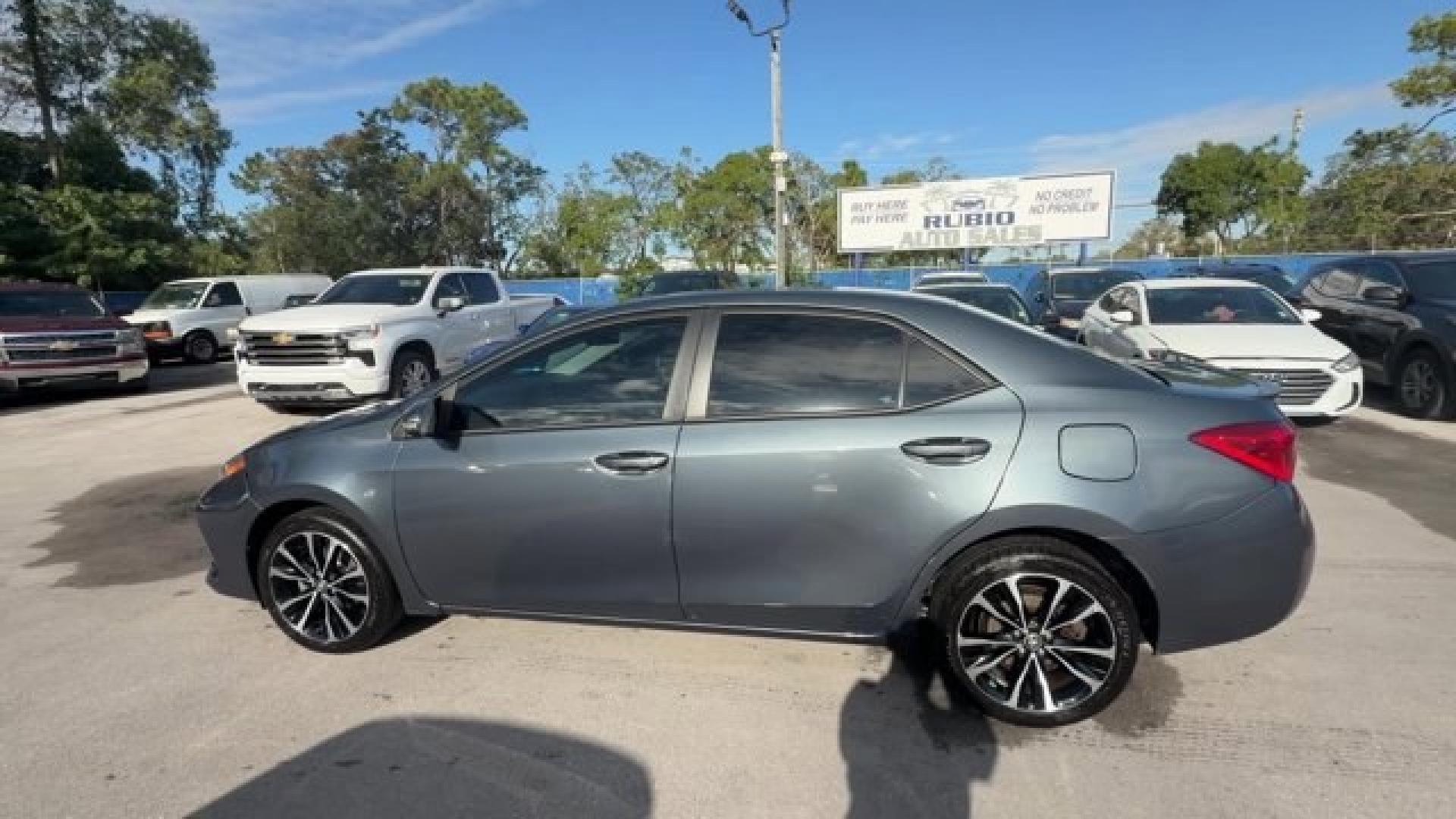 2018 Gray Toyota Corolla (5YFBURHEXJP) with an 4 1.8 L engine, Variable transmission, located at 27610 S Dixie Hwy, Homestead, FL, 33032, (305) 749-2348, 25.510241, -80.438301 - KBB.com 10 Most Awarded Brands. This Toyota Corolla boasts a Regular Unleaded I-4 1.8 L/110 engine powering this Variable transmission. Wireless Phone Connectivity, Urethane Gear Shifter Material, Trunk Rear Cargo Access.*This Toyota Corolla Comes Equipped with These Options *Trip Computer, Transmis - Photo#4