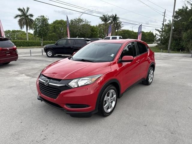 2018 Red Honda HR-V (3CZRU5H32JM) with an 4 1.8 L engine, Variable transmission, located at 27610 S Dixie Hwy, Homestead, FL, 33032, (305) 749-2348, 25.510241, -80.438301 - KBB.com Brand Image Awards. Boasts 33 Highway MPG and 25 City MPG! This Honda HR-V delivers a Regular Unleaded I-4 1.8 L/110 engine powering this Variable transmission. Wireless Phone Connectivity, Wheels: 17 Machine-Finished Alloy w/Silver Insert, VSA Electronic Stability Control (ESC).*This Honda - Photo#0