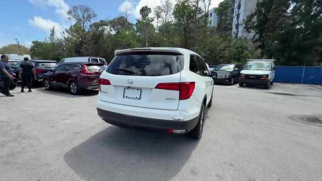 2017 White Honda Pilot (5FNYF6H39HB) with an 6 3.5 L engine, Automatic transmission, located at 27610 S Dixie Hwy, Homestead, FL, 33032, (305) 749-2348, 25.510241, -80.438301 - IIHS Top Safety Pick+. Only 96,081 Miles! Boasts 26 Highway MPG and 18 City MPG! This Honda Pilot boasts a Regular Unleaded V-6 3.5 L/212 engine powering this Automatic transmission. Wireless Phone Connectivity, Window Grid Antenna, Wheels: 18 Alloy.*This Honda Pilot Comes Equipped with These Option - Photo#4