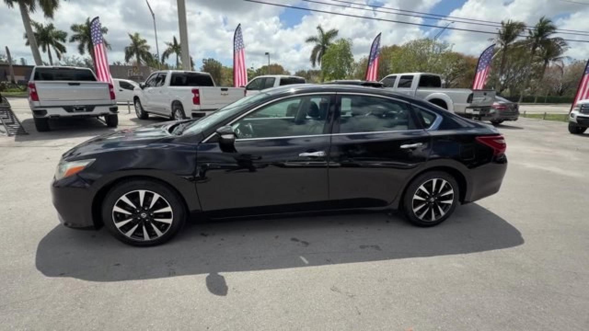 2018 Super Black /Charcoal Nissan Altima (1N4AL3AP3JC) with an 4 2.5 L engine, Variable transmission, located at 27610 S Dixie Hwy, Homestead, FL, 33032, (305) 749-2348, 25.510241, -80.438301 - Only 94,116 Miles! Delivers 38 Highway MPG and 27 City MPG! This Nissan Altima delivers a Regular Unleaded I-4 2.5 L/152 engine powering this Variable transmission. CHARCOAL, LEATHER APPOINTED SEAT TRIM, [Z66] ACTIVATION DISCLAIMER, [L92] FLOOR MATS PLUS TRUNK MAT (5-PIECE CARPETED).*This Nissan Alt - Photo#1