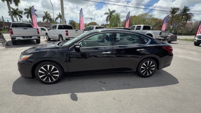 2018 Super Black /Charcoal Nissan Altima (1N4AL3AP3JC) with an 4 2.5 L engine, Variable transmission, located at 27610 S Dixie Hwy, Homestead, FL, 33032, (305) 749-2348, 25.510241, -80.438301 - Only 94,116 Miles! Delivers 38 Highway MPG and 27 City MPG! This Nissan Altima delivers a Regular Unleaded I-4 2.5 L/152 engine powering this Variable transmission. CHARCOAL, LEATHER APPOINTED SEAT TRIM, [Z66] ACTIVATION DISCLAIMER, [L92] FLOOR MATS PLUS TRUNK MAT (5-PIECE CARPETED).*This Nissan Alt - Photo#1