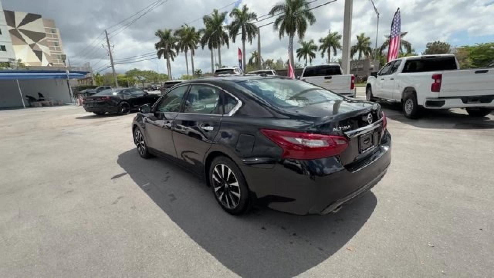 2018 Super Black /Charcoal Nissan Altima (1N4AL3AP3JC) with an 4 2.5 L engine, Variable transmission, located at 27610 S Dixie Hwy, Homestead, FL, 33032, (305) 749-2348, 25.510241, -80.438301 - Only 94,116 Miles! Delivers 38 Highway MPG and 27 City MPG! This Nissan Altima delivers a Regular Unleaded I-4 2.5 L/152 engine powering this Variable transmission. CHARCOAL, LEATHER APPOINTED SEAT TRIM, [Z66] ACTIVATION DISCLAIMER, [L92] FLOOR MATS PLUS TRUNK MAT (5-PIECE CARPETED).*This Nissan Alt - Photo#2