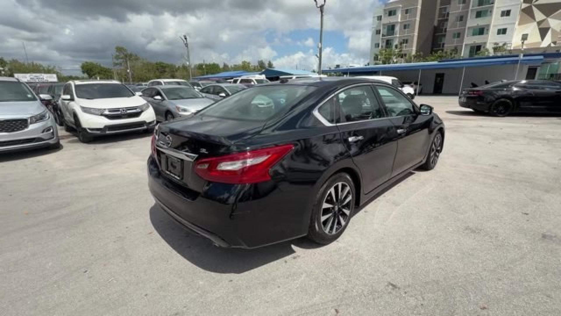2018 Super Black /Charcoal Nissan Altima (1N4AL3AP3JC) with an 4 2.5 L engine, Variable transmission, located at 27610 S Dixie Hwy, Homestead, FL, 33032, (305) 749-2348, 25.510241, -80.438301 - Only 94,116 Miles! Delivers 38 Highway MPG and 27 City MPG! This Nissan Altima delivers a Regular Unleaded I-4 2.5 L/152 engine powering this Variable transmission. CHARCOAL, LEATHER APPOINTED SEAT TRIM, [Z66] ACTIVATION DISCLAIMER, [L92] FLOOR MATS PLUS TRUNK MAT (5-PIECE CARPETED).*This Nissan Alt - Photo#4