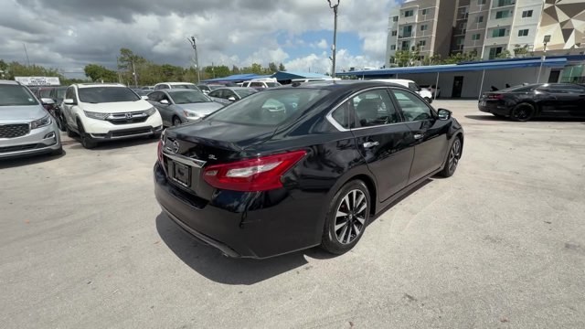 2018 Super Black /Charcoal Nissan Altima (1N4AL3AP3JC) with an 4 2.5 L engine, Variable transmission, located at 27610 S Dixie Hwy, Homestead, FL, 33032, (305) 749-2348, 25.510241, -80.438301 - Only 94,116 Miles! Delivers 38 Highway MPG and 27 City MPG! This Nissan Altima delivers a Regular Unleaded I-4 2.5 L/152 engine powering this Variable transmission. CHARCOAL, LEATHER APPOINTED SEAT TRIM, [Z66] ACTIVATION DISCLAIMER, [L92] FLOOR MATS PLUS TRUNK MAT (5-PIECE CARPETED).*This Nissan Alt - Photo#4