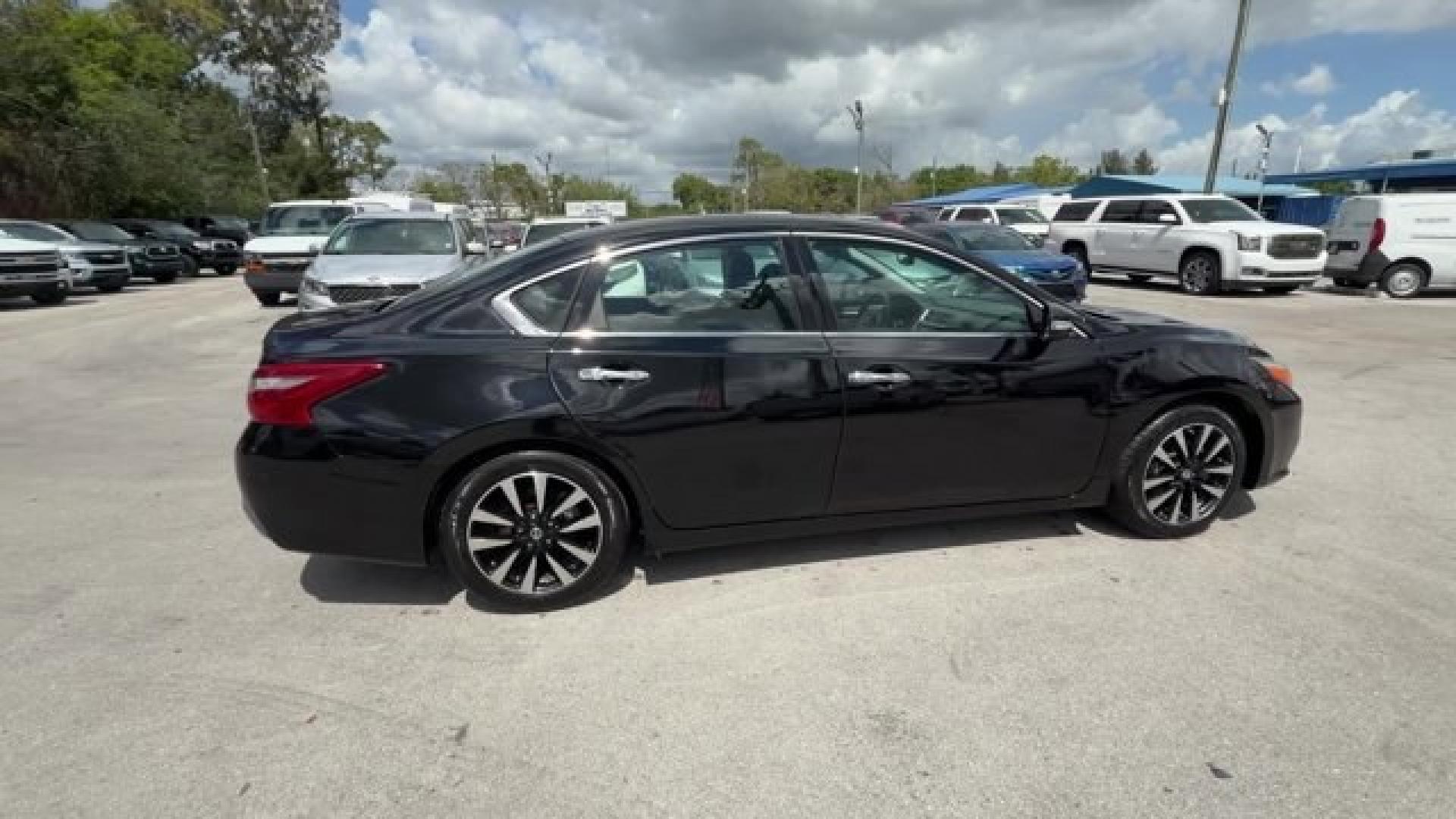 2018 Super Black /Charcoal Nissan Altima (1N4AL3AP3JC) with an 4 2.5 L engine, Variable transmission, located at 27610 S Dixie Hwy, Homestead, FL, 33032, (305) 749-2348, 25.510241, -80.438301 - Only 94,116 Miles! Delivers 38 Highway MPG and 27 City MPG! This Nissan Altima delivers a Regular Unleaded I-4 2.5 L/152 engine powering this Variable transmission. CHARCOAL, LEATHER APPOINTED SEAT TRIM, [Z66] ACTIVATION DISCLAIMER, [L92] FLOOR MATS PLUS TRUNK MAT (5-PIECE CARPETED).*This Nissan Alt - Photo#5