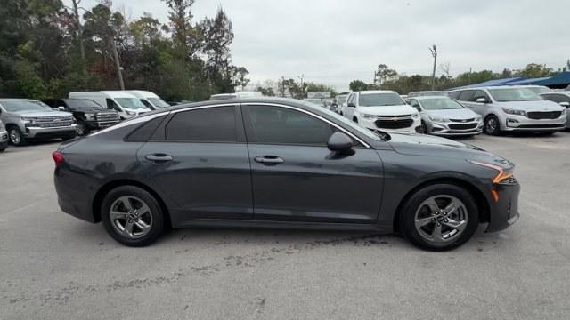 2021 Gravity Gray /Black Kia K5 (5XXG14J25MG) with an 4 1.6 L engine, Automatic transmission, located at 27610 S Dixie Hwy, Homestead, FL, 33032, (305) 749-2348, 25.510241, -80.438301 - Delivers 37 Highway MPG and 27 City MPG! This Kia K5 boasts a Intercooled Turbo Regular Unleaded I-4 1.6 L/98 engine powering this Automatic transmission. CARPETED FLOOR MATS, BLACK, CLOTH SEAT TRIM, Wireless Phone Connectivity.* This Kia K5 Features the Following Options *Window Grid Antenna, Wheel - Photo#5