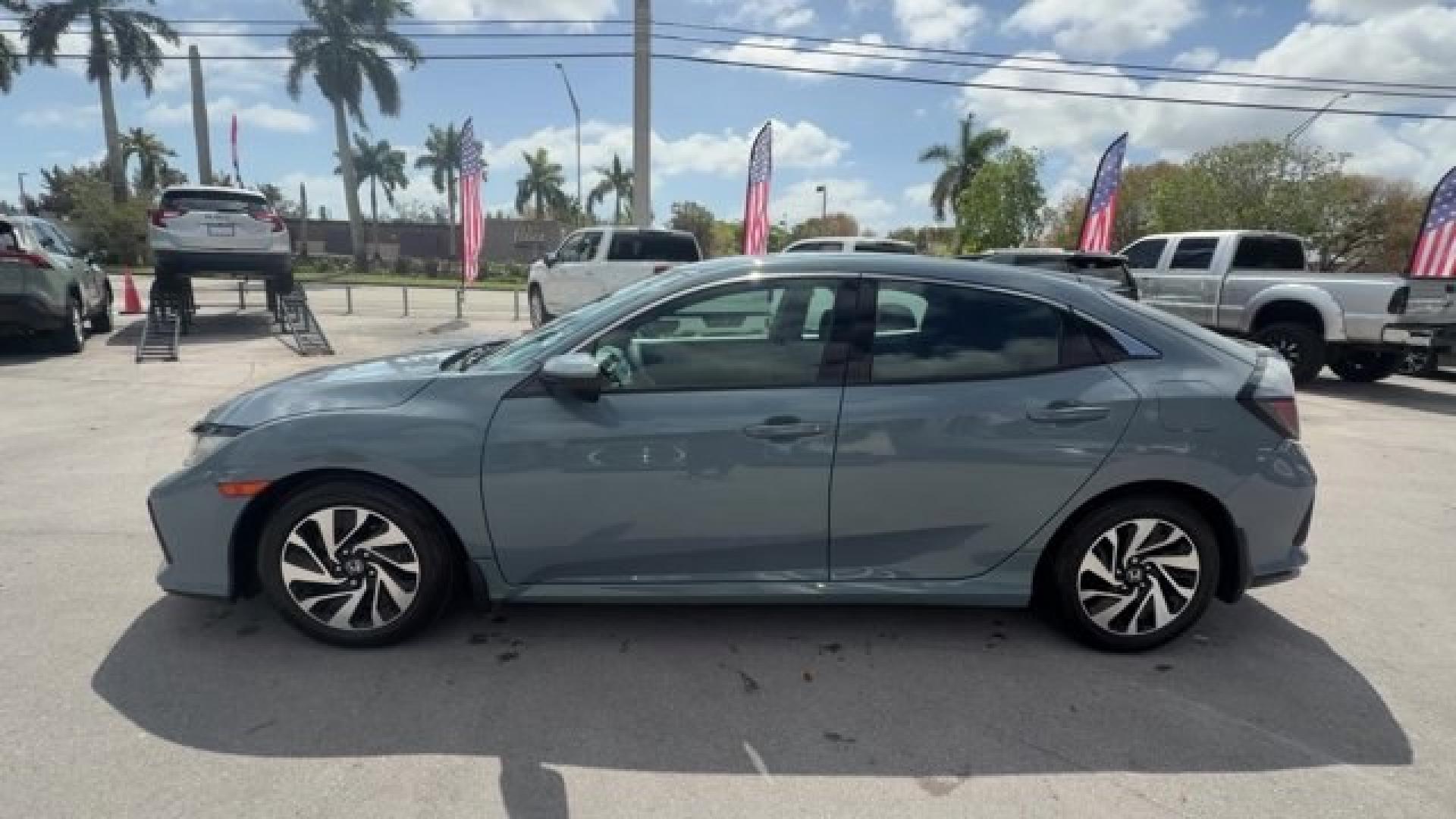 2017 Gray Honda Civic Hatchback (SHHFK7H28HU) with an 4 1.5 L engine, Variable transmission, located at 27610 S Dixie Hwy, Homestead, FL, 33032, (305) 749-2348, 25.510241, -80.438301 - KBB.com 10 Most Awarded Brands. Boasts 40 Highway MPG and 31 City MPG! This Honda Civic Hatchback delivers a Intercooled Turbo Regular Unleaded I-4 1.5 L/91 engine powering this Variable transmission. Wireless Phone Connectivity, Wheels: 16 Alloy, Wheels w/Silver Accents.*This Honda Civic Hatchback - Photo#0