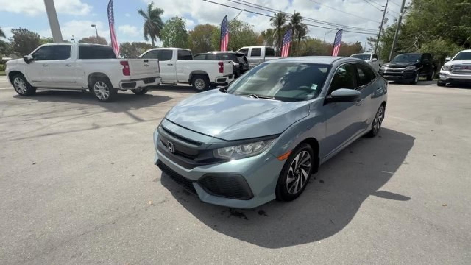 2017 Gray Honda Civic Hatchback (SHHFK7H28HU) with an 4 1.5 L engine, Variable transmission, located at 27610 S Dixie Hwy, Homestead, FL, 33032, (305) 749-2348, 25.510241, -80.438301 - KBB.com 10 Most Awarded Brands. Boasts 40 Highway MPG and 31 City MPG! This Honda Civic Hatchback delivers a Intercooled Turbo Regular Unleaded I-4 1.5 L/91 engine powering this Variable transmission. Wireless Phone Connectivity, Wheels: 16 Alloy, Wheels w/Silver Accents.*This Honda Civic Hatchback - Photo#1