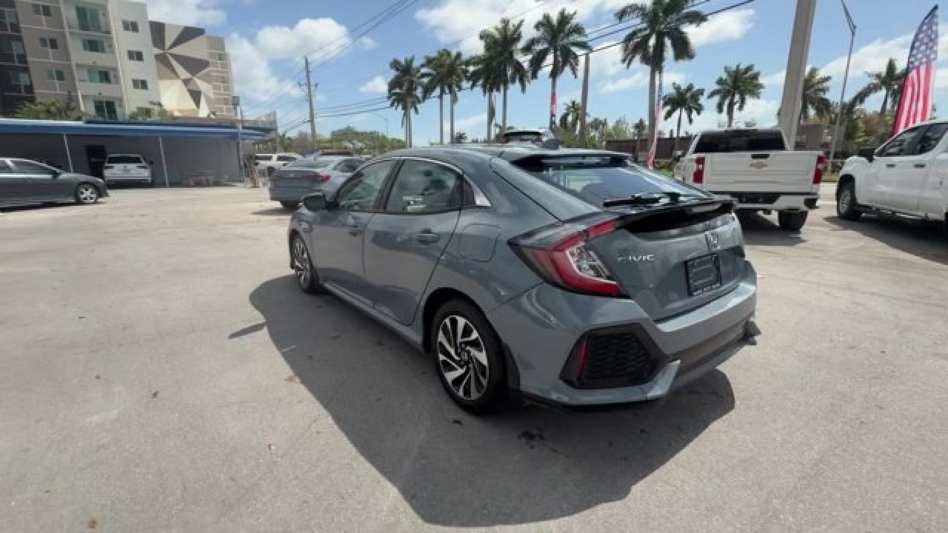 2017 Gray Honda Civic Hatchback (SHHFK7H28HU) with an 4 1.5 L engine, Variable transmission, located at 27610 S Dixie Hwy, Homestead, FL, 33032, (305) 749-2348, 25.510241, -80.438301 - KBB.com 10 Most Awarded Brands. Boasts 40 Highway MPG and 31 City MPG! This Honda Civic Hatchback delivers a Intercooled Turbo Regular Unleaded I-4 1.5 L/91 engine powering this Variable transmission. Wireless Phone Connectivity, Wheels: 16 Alloy, Wheels w/Silver Accents.*This Honda Civic Hatchback - Photo#2