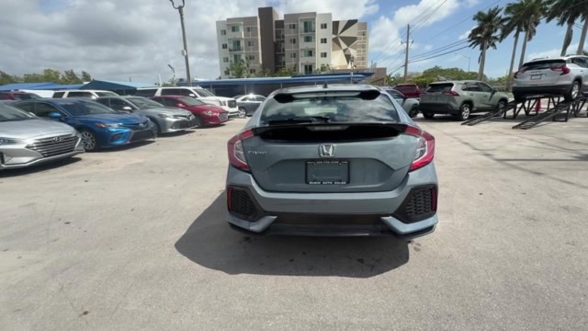 2017 Gray Honda Civic Hatchback (SHHFK7H28HU) with an 4 1.5 L engine, Variable transmission, located at 27610 S Dixie Hwy, Homestead, FL, 33032, (305) 749-2348, 25.510241, -80.438301 - KBB.com 10 Most Awarded Brands. Boasts 40 Highway MPG and 31 City MPG! This Honda Civic Hatchback delivers a Intercooled Turbo Regular Unleaded I-4 1.5 L/91 engine powering this Variable transmission. Wireless Phone Connectivity, Wheels: 16 Alloy, Wheels w/Silver Accents.*This Honda Civic Hatchback - Photo#3