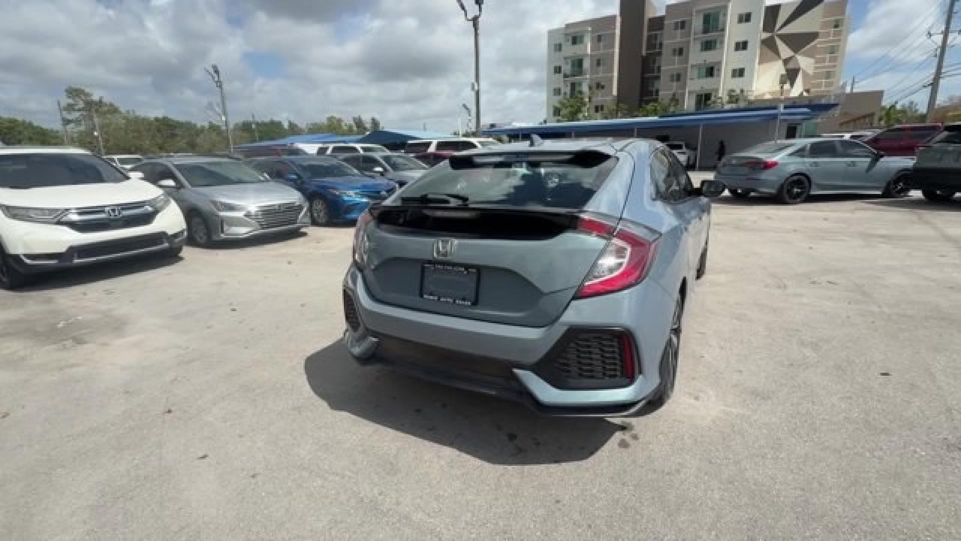 2017 Gray Honda Civic Hatchback (SHHFK7H28HU) with an 4 1.5 L engine, Variable transmission, located at 27610 S Dixie Hwy, Homestead, FL, 33032, (305) 749-2348, 25.510241, -80.438301 - KBB.com 10 Most Awarded Brands. Boasts 40 Highway MPG and 31 City MPG! This Honda Civic Hatchback delivers a Intercooled Turbo Regular Unleaded I-4 1.5 L/91 engine powering this Variable transmission. Wireless Phone Connectivity, Wheels: 16 Alloy, Wheels w/Silver Accents.*This Honda Civic Hatchback - Photo#4
