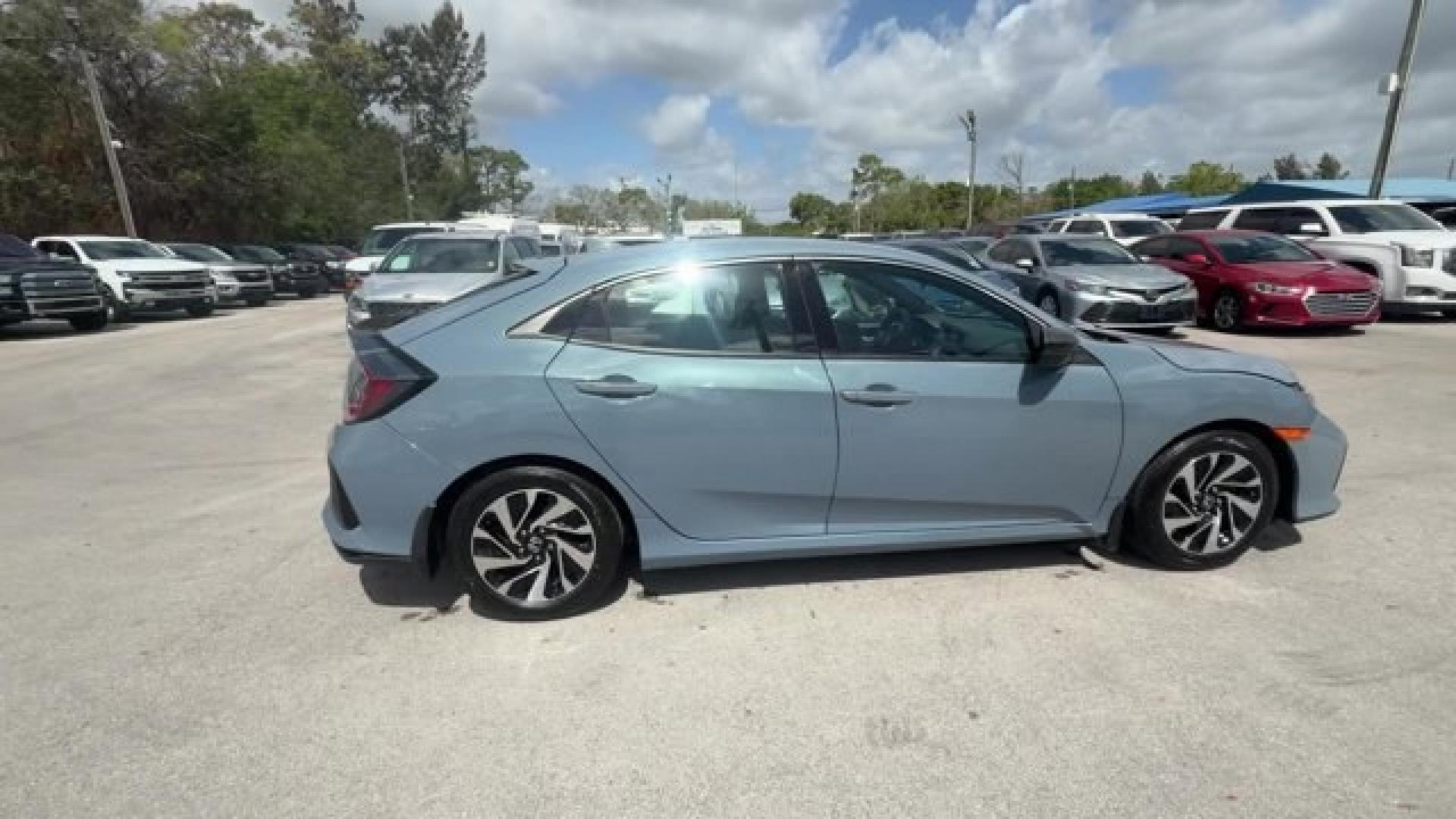 2017 Gray Honda Civic Hatchback (SHHFK7H28HU) with an 4 1.5 L engine, Variable transmission, located at 27610 S Dixie Hwy, Homestead, FL, 33032, (305) 749-2348, 25.510241, -80.438301 - KBB.com 10 Most Awarded Brands. Boasts 40 Highway MPG and 31 City MPG! This Honda Civic Hatchback delivers a Intercooled Turbo Regular Unleaded I-4 1.5 L/91 engine powering this Variable transmission. Wireless Phone Connectivity, Wheels: 16 Alloy, Wheels w/Silver Accents.*This Honda Civic Hatchback - Photo#5