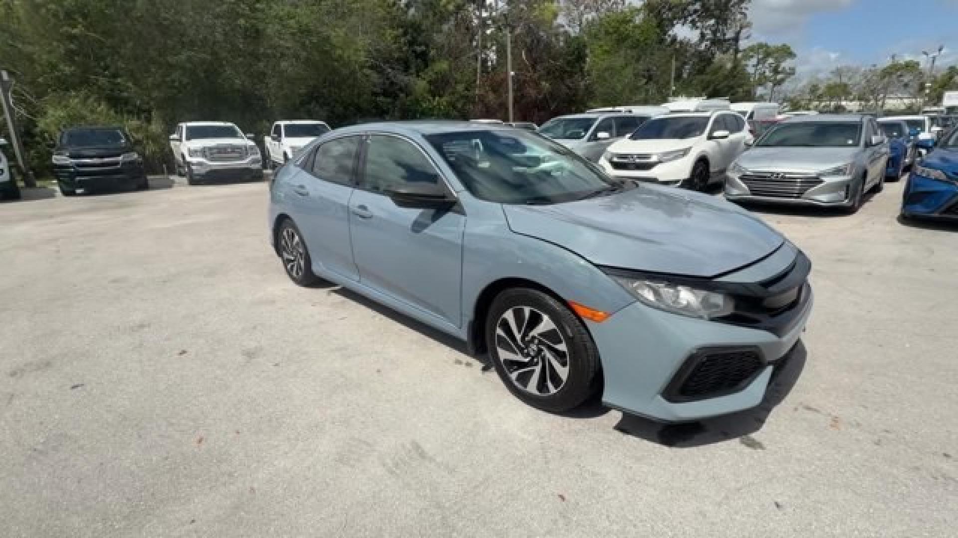 2017 Gray Honda Civic Hatchback (SHHFK7H28HU) with an 4 1.5 L engine, Variable transmission, located at 27610 S Dixie Hwy, Homestead, FL, 33032, (305) 749-2348, 25.510241, -80.438301 - KBB.com 10 Most Awarded Brands. Boasts 40 Highway MPG and 31 City MPG! This Honda Civic Hatchback delivers a Intercooled Turbo Regular Unleaded I-4 1.5 L/91 engine powering this Variable transmission. Wireless Phone Connectivity, Wheels: 16 Alloy, Wheels w/Silver Accents.*This Honda Civic Hatchback - Photo#6