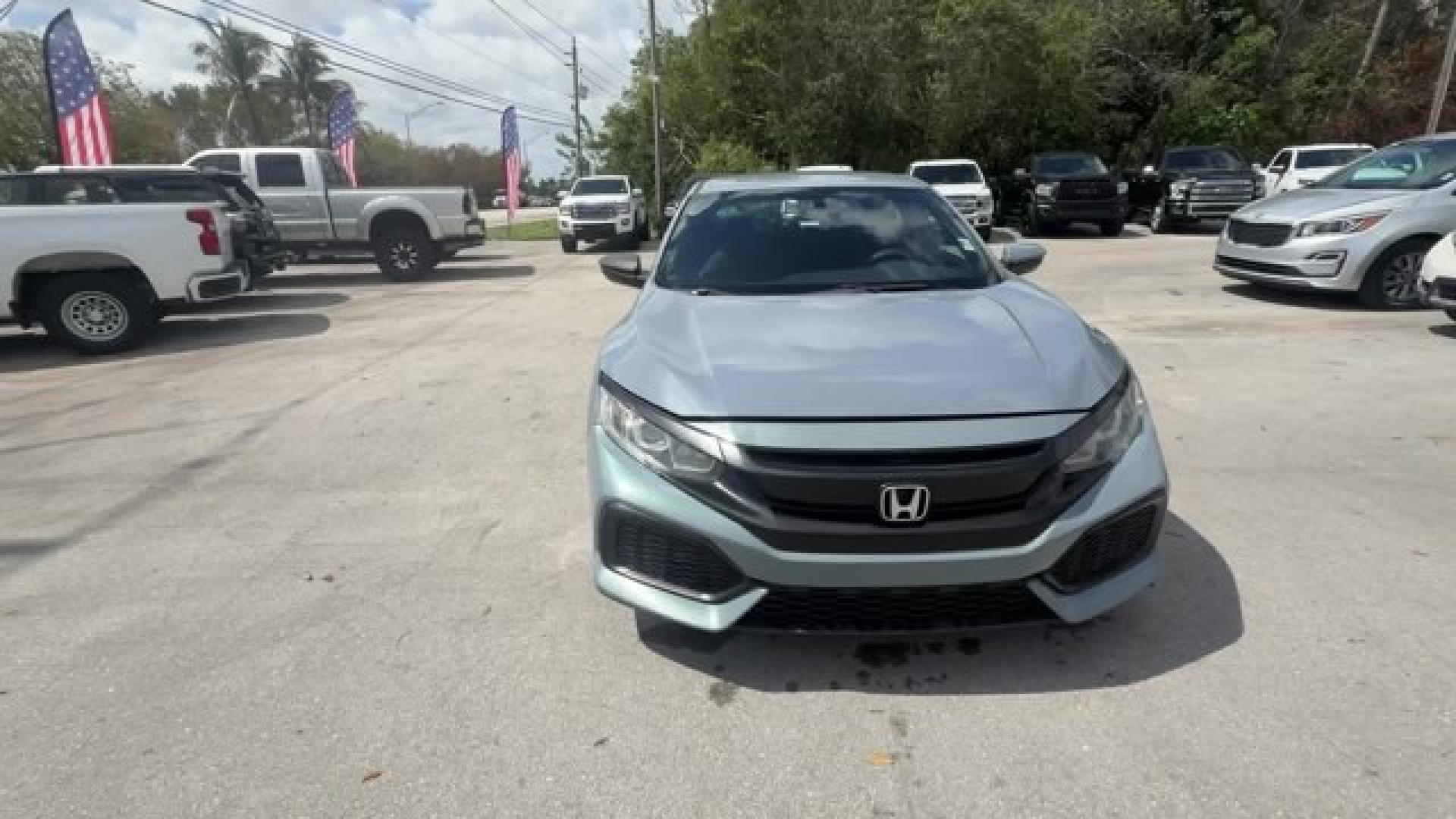 2017 Gray Honda Civic Hatchback (SHHFK7H28HU) with an 4 1.5 L engine, Variable transmission, located at 27610 S Dixie Hwy, Homestead, FL, 33032, (305) 749-2348, 25.510241, -80.438301 - KBB.com 10 Most Awarded Brands. Boasts 40 Highway MPG and 31 City MPG! This Honda Civic Hatchback delivers a Intercooled Turbo Regular Unleaded I-4 1.5 L/91 engine powering this Variable transmission. Wireless Phone Connectivity, Wheels: 16 Alloy, Wheels w/Silver Accents.*This Honda Civic Hatchback - Photo#7