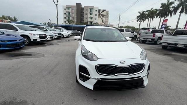2021 Clear White /Black Kia Sportage (KNDPM3AC7M7) with an 4 2.4 L engine, Automatic transmission, located at 27610 S Dixie Hwy, Homestead, FL, 33032, (305) 749-2348, 25.510241, -80.438301 - Delivers 30 Highway MPG and 23 City MPG! This Kia Sportage delivers a Regular Unleaded I-4 2.4 L/144 engine powering this Automatic transmission. CLEAR WHITE, CARPET FLOOR MATS, BLACK, UPGRADED CLOTH SEAT TRIM -inc: YES Essentials.*This Kia Sportage Comes Equipped with These Options *BLACK, CLOTH SE - Photo#7