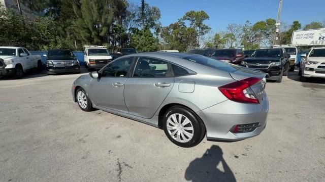 2019 Silver Honda Civic Sedan (19XFC2F6XKE) with an 4 2.0 L engine, Variable transmission, located at 27610 S Dixie Hwy, Homestead, FL, 33032, (305) 749-2348, 25.510241, -80.438301 - Boasts 38 Highway MPG and 30 City MPG! This Honda Civic Sedan boasts a Regular Unleaded I-4 2.0 L/122 engine powering this Variable transmission. Wireless Phone Connectivity, Window Grid Antenna, Wheels: 16 w/Full Covers.* This Honda Civic Sedan Features the Following Options *Wheels w/Full Wheel Co - Photo#2