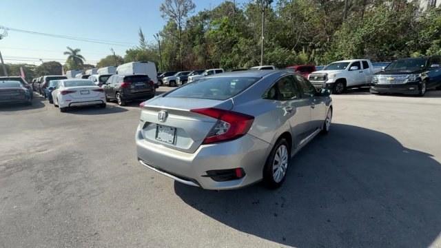 2019 Silver Honda Civic Sedan (19XFC2F6XKE) with an 4 2.0 L engine, Variable transmission, located at 27610 S Dixie Hwy, Homestead, FL, 33032, (305) 749-2348, 25.510241, -80.438301 - Boasts 38 Highway MPG and 30 City MPG! This Honda Civic Sedan boasts a Regular Unleaded I-4 2.0 L/122 engine powering this Variable transmission. Wireless Phone Connectivity, Window Grid Antenna, Wheels: 16 w/Full Covers.* This Honda Civic Sedan Features the Following Options *Wheels w/Full Wheel Co - Photo#4