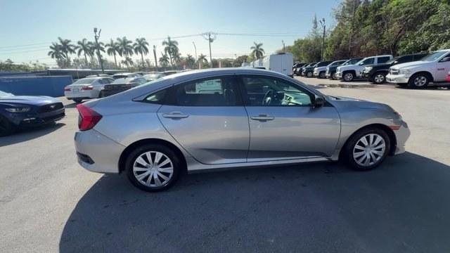 2019 Silver Honda Civic Sedan (19XFC2F6XKE) with an 4 2.0 L engine, Variable transmission, located at 27610 S Dixie Hwy, Homestead, FL, 33032, (305) 749-2348, 25.510241, -80.438301 - Boasts 38 Highway MPG and 30 City MPG! This Honda Civic Sedan boasts a Regular Unleaded I-4 2.0 L/122 engine powering this Variable transmission. Wireless Phone Connectivity, Window Grid Antenna, Wheels: 16 w/Full Covers.* This Honda Civic Sedan Features the Following Options *Wheels w/Full Wheel Co - Photo#5