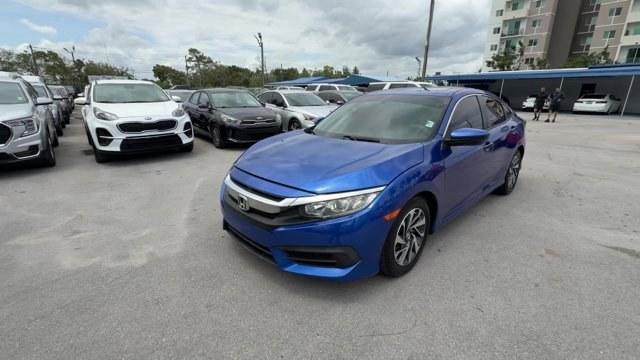 2017 Blue Honda Civic Sedan (19XFC2F79HE) with an 4 2.0 L engine, Variable transmission, located at 27610 S Dixie Hwy, Homestead, FL, 33032, (305) 749-2348, 25.510241, -80.438301 - IIHS Top Safety Pick. Delivers 40 Highway MPG and 31 City MPG! This Honda Civic Sedan boasts a Regular Unleaded I-4 2.0 L/122 engine powering this Variable transmission. Wireless Phone Connectivity, Window Grid Antenna, Wheels: 16 Alloy.*This Honda Civic Sedan Comes Equipped with These Options *Whee - Photo#0