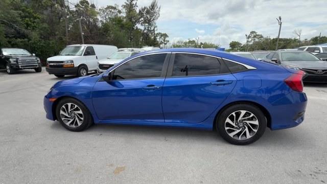 2017 Blue Honda Civic Sedan (19XFC2F79HE) with an 4 2.0 L engine, Variable transmission, located at 27610 S Dixie Hwy, Homestead, FL, 33032, (305) 749-2348, 25.510241, -80.438301 - IIHS Top Safety Pick. Delivers 40 Highway MPG and 31 City MPG! This Honda Civic Sedan boasts a Regular Unleaded I-4 2.0 L/122 engine powering this Variable transmission. Wireless Phone Connectivity, Window Grid Antenna, Wheels: 16 Alloy.*This Honda Civic Sedan Comes Equipped with These Options *Whee - Photo#1