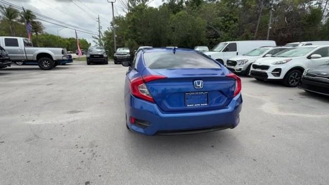 2017 Blue Honda Civic Sedan (19XFC2F79HE) with an 4 2.0 L engine, Variable transmission, located at 27610 S Dixie Hwy, Homestead, FL, 33032, (305) 749-2348, 25.510241, -80.438301 - IIHS Top Safety Pick. Delivers 40 Highway MPG and 31 City MPG! This Honda Civic Sedan boasts a Regular Unleaded I-4 2.0 L/122 engine powering this Variable transmission. Wireless Phone Connectivity, Window Grid Antenna, Wheels: 16 Alloy.*This Honda Civic Sedan Comes Equipped with These Options *Whee - Photo#3