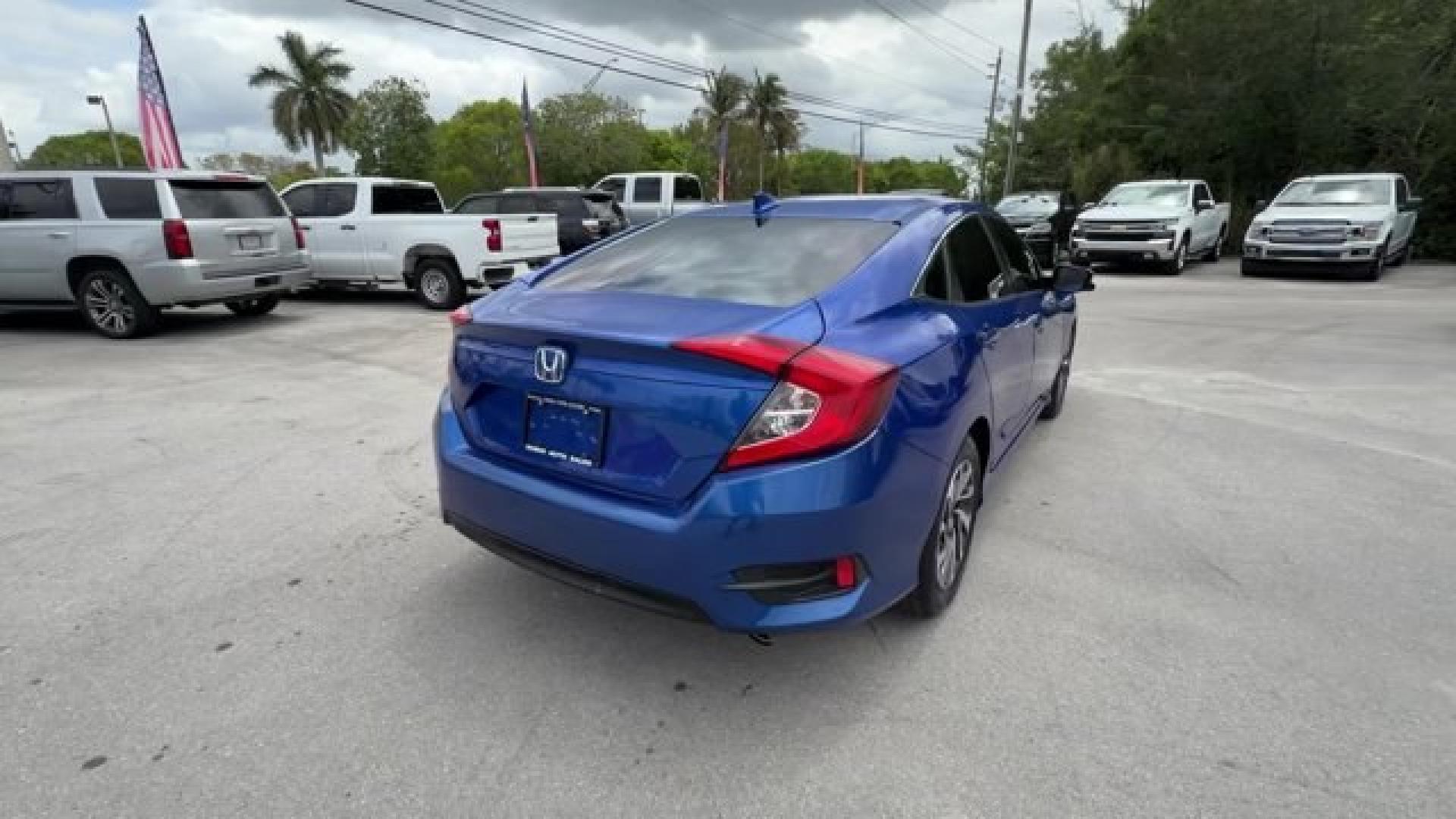 2017 Blue Honda Civic Sedan (19XFC2F79HE) with an 4 2.0 L engine, Variable transmission, located at 27610 S Dixie Hwy, Homestead, FL, 33032, (305) 749-2348, 25.510241, -80.438301 - IIHS Top Safety Pick. Delivers 40 Highway MPG and 31 City MPG! This Honda Civic Sedan boasts a Regular Unleaded I-4 2.0 L/122 engine powering this Variable transmission. Wireless Phone Connectivity, Window Grid Antenna, Wheels: 16 Alloy.*This Honda Civic Sedan Comes Equipped with These Options *Whee - Photo#4