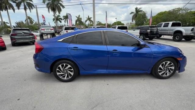 2017 Blue Honda Civic Sedan (19XFC2F79HE) with an 4 2.0 L engine, Variable transmission, located at 27610 S Dixie Hwy, Homestead, FL, 33032, (305) 749-2348, 25.510241, -80.438301 - IIHS Top Safety Pick. Delivers 40 Highway MPG and 31 City MPG! This Honda Civic Sedan boasts a Regular Unleaded I-4 2.0 L/122 engine powering this Variable transmission. Wireless Phone Connectivity, Window Grid Antenna, Wheels: 16 Alloy.*This Honda Civic Sedan Comes Equipped with These Options *Whee - Photo#5