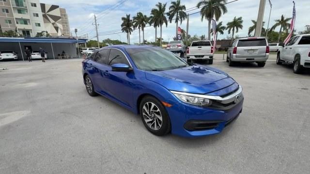 2017 Blue Honda Civic Sedan (19XFC2F79HE) with an 4 2.0 L engine, Variable transmission, located at 27610 S Dixie Hwy, Homestead, FL, 33032, (305) 749-2348, 25.510241, -80.438301 - IIHS Top Safety Pick. Delivers 40 Highway MPG and 31 City MPG! This Honda Civic Sedan boasts a Regular Unleaded I-4 2.0 L/122 engine powering this Variable transmission. Wireless Phone Connectivity, Window Grid Antenna, Wheels: 16 Alloy.*This Honda Civic Sedan Comes Equipped with These Options *Whee - Photo#6