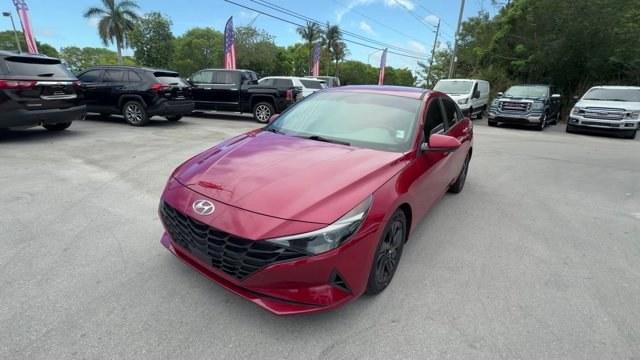 2021 Scarlet Red Pearl /Medium Gray Hyundai Elantra (KMHLS4AG3MU) with an 4 2.0 L engine, Variable transmission, located at 27610 S Dixie Hwy, Homestead, FL, 33032, (305) 749-2348, 25.510241, -80.438301 - NACTOY 2021 North American Car of the Year. Delivers 41 Highway MPG and 31 City MPG! This Hyundai Elantra boasts a Regular Unleaded I-4 2.0 L/122 engine powering this Variable transmission. WHEEL LOCKS, SCARLET RED PEARL, REVERSIBLE CARGO TRAY.* This Hyundai Elantra Features the Following Options *C - Photo#0