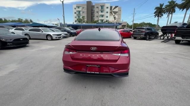 2021 Scarlet Red Pearl /Medium Gray Hyundai Elantra (KMHLS4AG3MU) with an 4 2.0 L engine, Variable transmission, located at 27610 S Dixie Hwy, Homestead, FL, 33032, (305) 749-2348, 25.510241, -80.438301 - NACTOY 2021 North American Car of the Year. Delivers 41 Highway MPG and 31 City MPG! This Hyundai Elantra boasts a Regular Unleaded I-4 2.0 L/122 engine powering this Variable transmission. WHEEL LOCKS, SCARLET RED PEARL, REVERSIBLE CARGO TRAY.* This Hyundai Elantra Features the Following Options *C - Photo#3