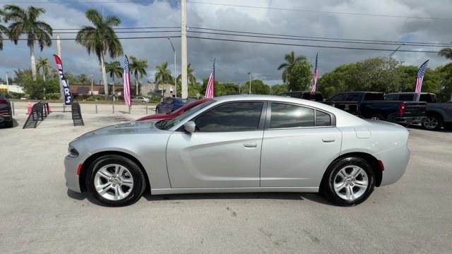 2021 Triple Nickel Clearcoat /Black Dodge Charger (2C3CDXBG6MH) with an 6 3.6 L engine, Automatic transmission, located at 27610 S Dixie Hwy, Homestead, FL, 33032, (305) 749-2348, 25.510241, -80.438301 - Scores 30 Highway MPG and 19 City MPG! This Dodge Charger delivers a Regular Unleaded V-6 3.6 L/220 engine powering this Automatic transmission. WHEELS: 17 X 7.0 PAINTED CAST ALUMINUM (STD), TRANSMISSION: 8-SPEED AUTOMATIC (8HP50) (STD), TIRES: P215/65R17 LOW ROLLING RES (STD).*This Dodge Charger Co - Photo#1