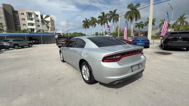 2021 Triple Nickel Clearcoat /Black Dodge Charger (2C3CDXBG6MH) with an 6 3.6 L engine, Automatic transmission, located at 27610 S Dixie Hwy, Homestead, FL, 33032, (305) 749-2348, 25.510241, -80.438301 - Scores 30 Highway MPG and 19 City MPG! This Dodge Charger delivers a Regular Unleaded V-6 3.6 L/220 engine powering this Automatic transmission. WHEELS: 17 X 7.0 PAINTED CAST ALUMINUM (STD), TRANSMISSION: 8-SPEED AUTOMATIC (8HP50) (STD), TIRES: P215/65R17 LOW ROLLING RES (STD).*This Dodge Charger Co - Photo#2