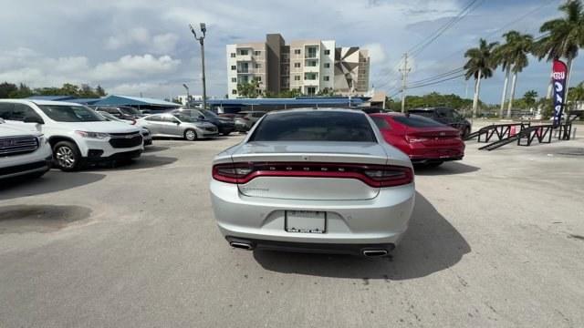 2021 Triple Nickel Clearcoat /Black Dodge Charger (2C3CDXBG6MH) with an 6 3.6 L engine, Automatic transmission, located at 27610 S Dixie Hwy, Homestead, FL, 33032, (305) 749-2348, 25.510241, -80.438301 - Scores 30 Highway MPG and 19 City MPG! This Dodge Charger delivers a Regular Unleaded V-6 3.6 L/220 engine powering this Automatic transmission. WHEELS: 17 X 7.0 PAINTED CAST ALUMINUM (STD), TRANSMISSION: 8-SPEED AUTOMATIC (8HP50) (STD), TIRES: P215/65R17 LOW ROLLING RES (STD).*This Dodge Charger Co - Photo#3