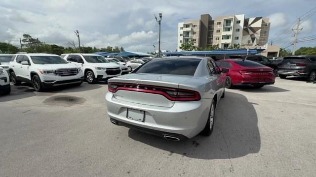 2021 Triple Nickel Clearcoat /Black Dodge Charger (2C3CDXBG6MH) with an 6 3.6 L engine, Automatic transmission, located at 27610 S Dixie Hwy, Homestead, FL, 33032, (305) 749-2348, 25.510241, -80.438301 - Scores 30 Highway MPG and 19 City MPG! This Dodge Charger delivers a Regular Unleaded V-6 3.6 L/220 engine powering this Automatic transmission. WHEELS: 17 X 7.0 PAINTED CAST ALUMINUM (STD), TRANSMISSION: 8-SPEED AUTOMATIC (8HP50) (STD), TIRES: P215/65R17 LOW ROLLING RES (STD).*This Dodge Charger Co - Photo#4