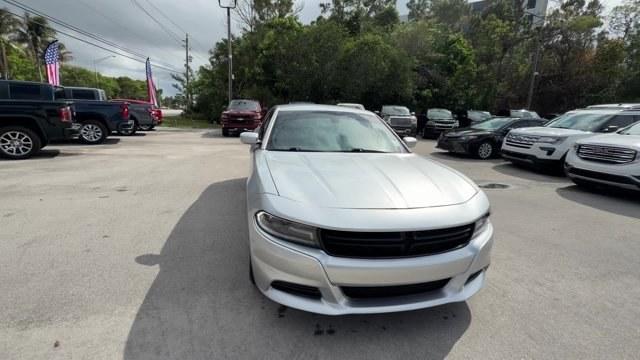 2021 Triple Nickel Clearcoat /Black Dodge Charger (2C3CDXBG6MH) with an 6 3.6 L engine, Automatic transmission, located at 27610 S Dixie Hwy, Homestead, FL, 33032, (305) 749-2348, 25.510241, -80.438301 - Scores 30 Highway MPG and 19 City MPG! This Dodge Charger delivers a Regular Unleaded V-6 3.6 L/220 engine powering this Automatic transmission. WHEELS: 17 X 7.0 PAINTED CAST ALUMINUM (STD), TRANSMISSION: 8-SPEED AUTOMATIC (8HP50) (STD), TIRES: P215/65R17 LOW ROLLING RES (STD).*This Dodge Charger Co - Photo#7