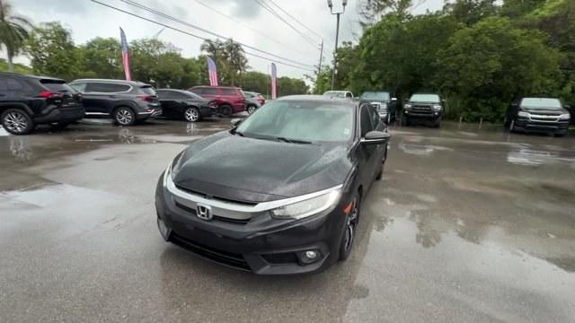 2016 Black Honda Civic Sedan (2HGFC1F92GH) with an 4 1.5 L engine, Variable transmission, located at 27610 S Dixie Hwy, Homestead, FL, 33032, (305) 749-2348, 25.510241, -80.438301 - IIHS Top Safety Pick+. Boasts 42 Highway MPG and 31 City MPG! This Honda Civic Sedan boasts a Intercooled Turbo Regular Unleaded I-4 1.5 L/91 engine powering this Variable transmission. Wireless Phone Connectivity, Wheels: 17 Alloy, Wheels w/Machined w/Painted Accents Accents.*This Honda Civic Sedan- Photo#0