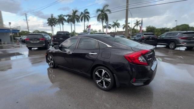 2016 Black Honda Civic Sedan (2HGFC1F92GH) with an 4 1.5 L engine, Variable transmission, located at 27610 S Dixie Hwy, Homestead, FL, 33032, (305) 749-2348, 25.510241, -80.438301 - IIHS Top Safety Pick+. Boasts 42 Highway MPG and 31 City MPG! This Honda Civic Sedan boasts a Intercooled Turbo Regular Unleaded I-4 1.5 L/91 engine powering this Variable transmission. Wireless Phone Connectivity, Wheels: 17 Alloy, Wheels w/Machined w/Painted Accents Accents.*This Honda Civic Sedan- Photo#1